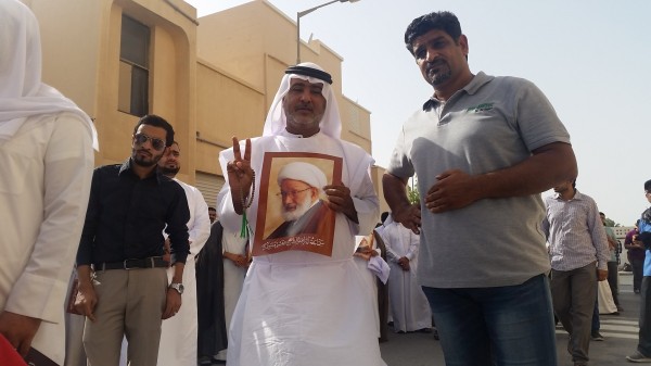 Activist Ali Mhanna gesturing the peace sign